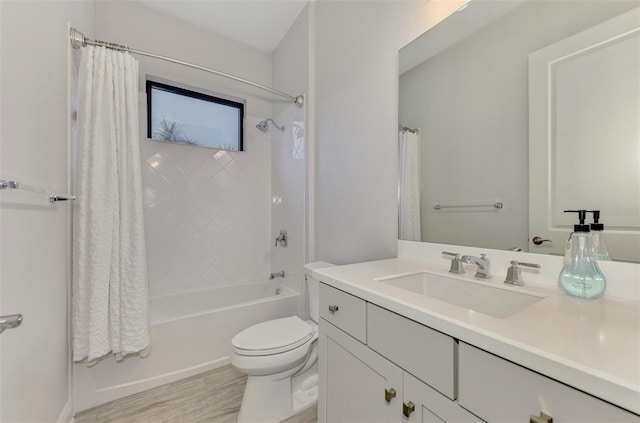 full bathroom with toilet, vanity, and shower / bath combo with shower curtain