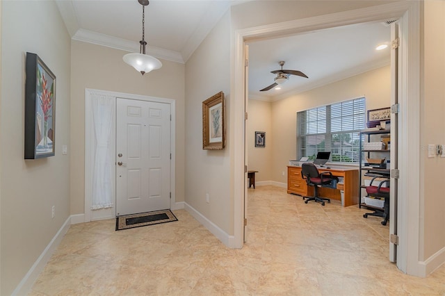 foyer featuring ceiling fan and ornamental molding