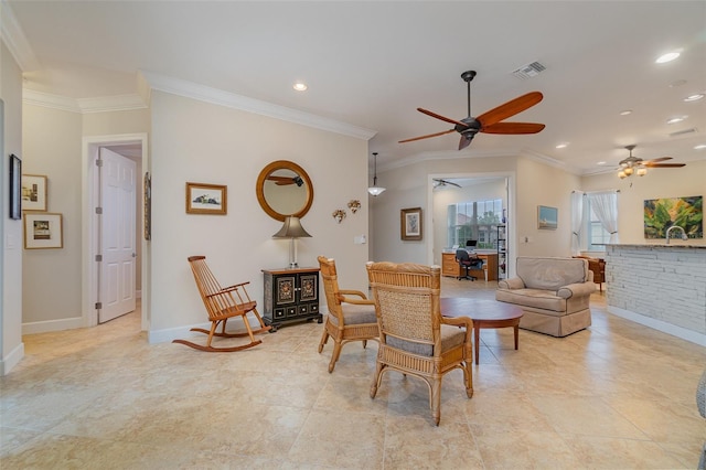 living room featuring ceiling fan and ornamental molding