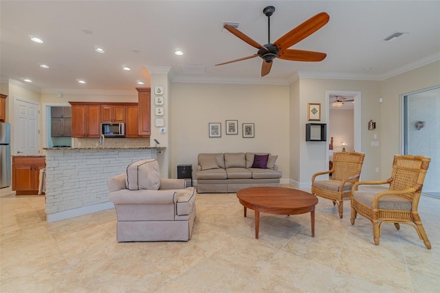 living room featuring ceiling fan and ornamental molding