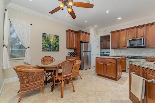 kitchen with stainless steel appliances, decorative backsplash, a kitchen island, light stone countertops, and ornamental molding