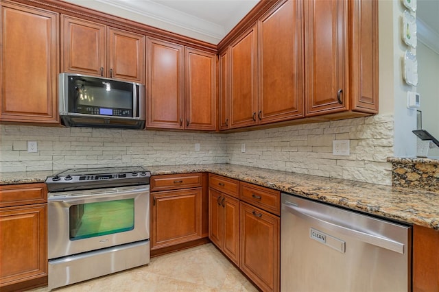 kitchen with light stone counters, decorative backsplash, appliances with stainless steel finishes, and ornamental molding