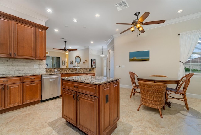 kitchen with stainless steel dishwasher, ornamental molding, tasteful backsplash, and a center island