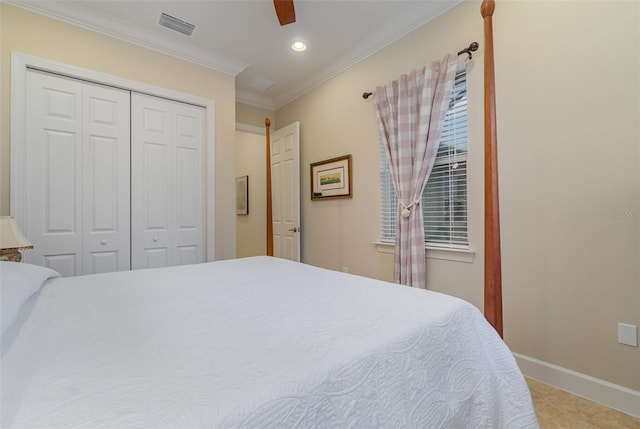 bedroom featuring ceiling fan, a closet, crown molding, and carpet floors