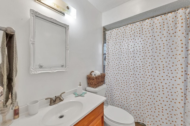 bathroom featuring vanity, curtained shower, toilet, and a textured ceiling