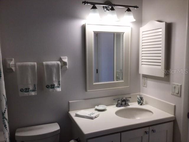 bathroom with vanity and toilet