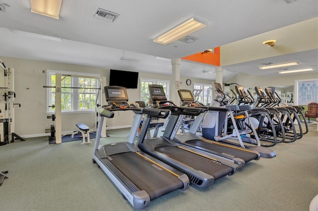 exercise room featuring ceiling fan