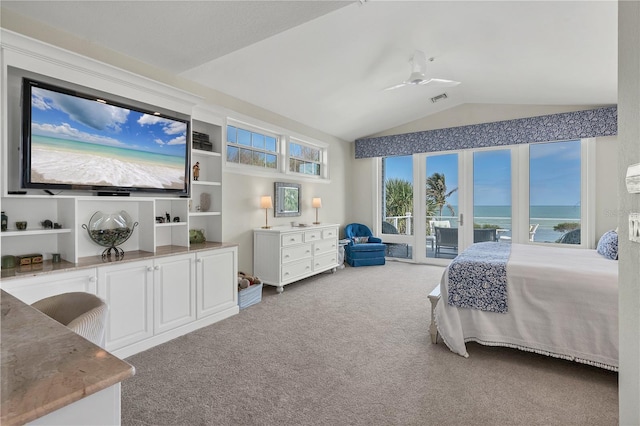 carpeted bedroom with ceiling fan, a water view, lofted ceiling, and access to outside