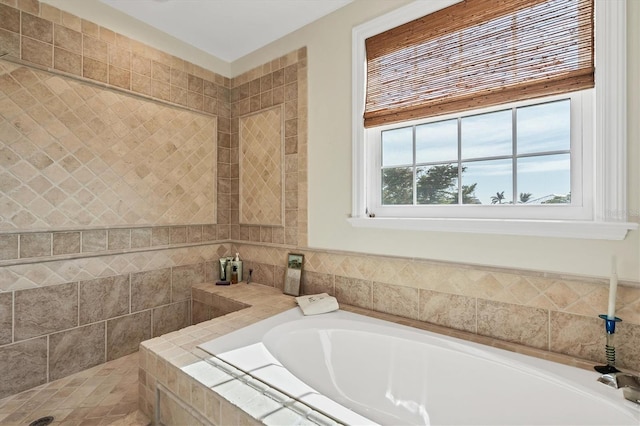 bathroom featuring a relaxing tiled tub