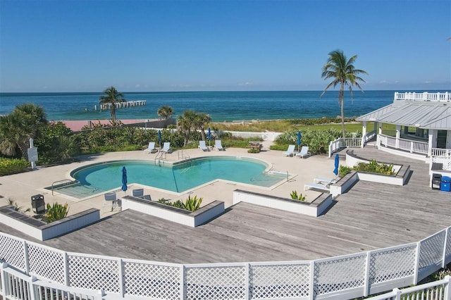 view of swimming pool with a deck with water view, a gazebo, and a patio