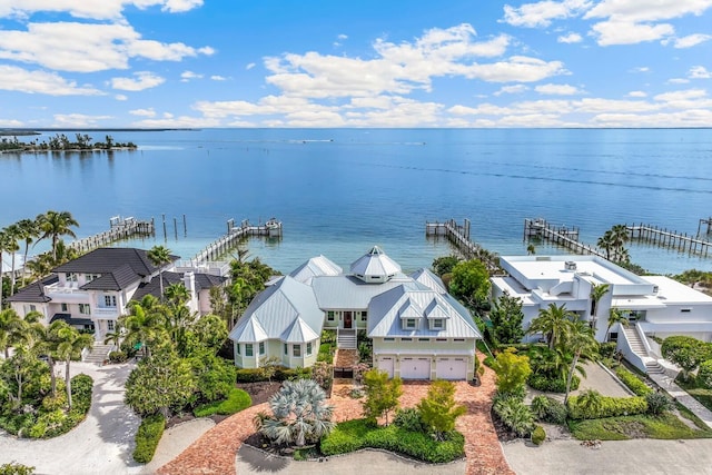 birds eye view of property featuring a water view