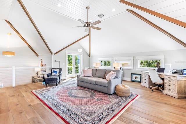 living room with beamed ceiling, high vaulted ceiling, and light hardwood / wood-style flooring