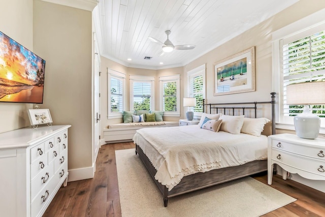 bedroom featuring dark hardwood / wood-style flooring, crown molding, wooden ceiling, and ceiling fan