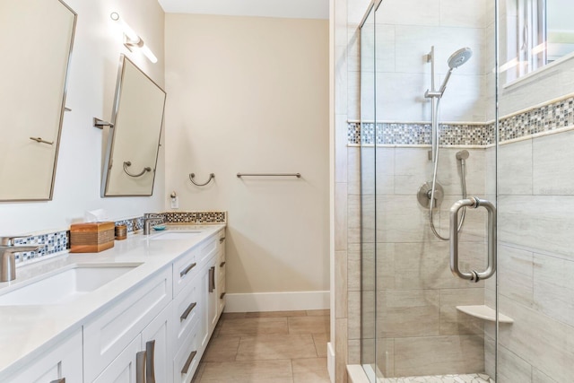 bathroom featuring vanity and an enclosed shower