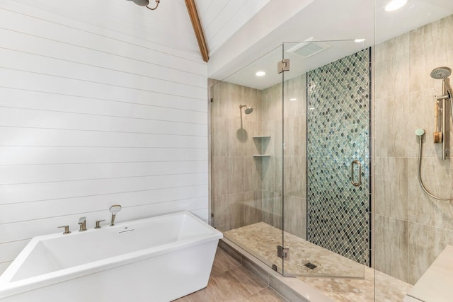 bathroom with shower with separate bathtub