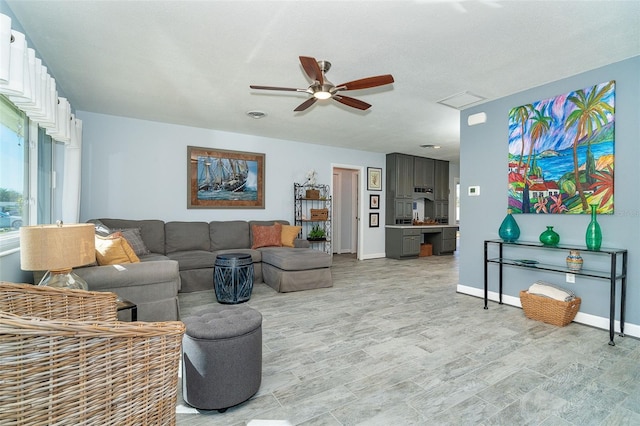 living room featuring ceiling fan