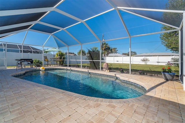 view of pool with a lanai and a patio area