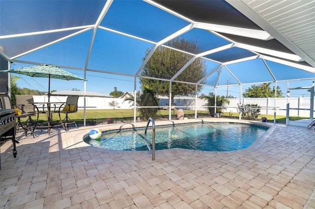 view of pool featuring a patio and glass enclosure