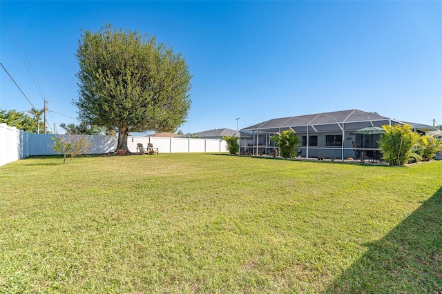 view of yard featuring a lanai