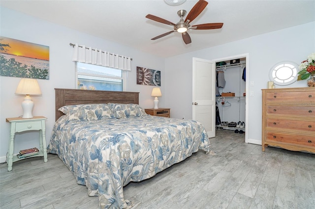 bedroom with a closet, ceiling fan, and light wood-type flooring