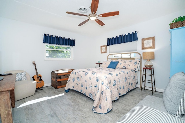 bedroom featuring wood-type flooring and ceiling fan