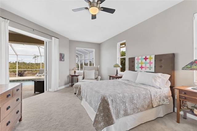 bedroom featuring ceiling fan, light colored carpet, and multiple windows