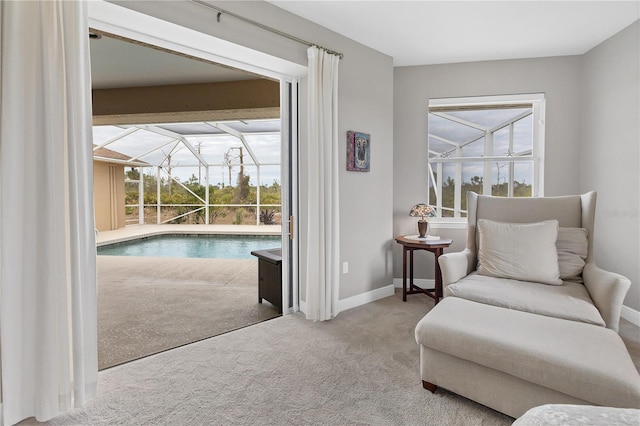 living area with a swimming pool and carpet