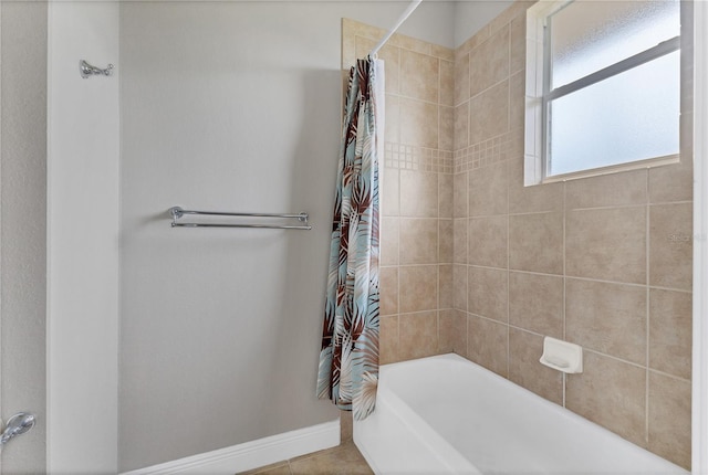 bathroom with shower / bathtub combination with curtain