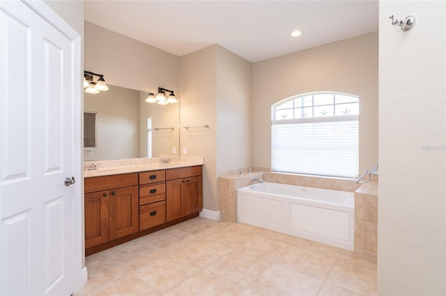 116 Hercules Dr, Rotonda West, FL 33947 - bathroom with a bath, double vanity, and tile patterned flooring