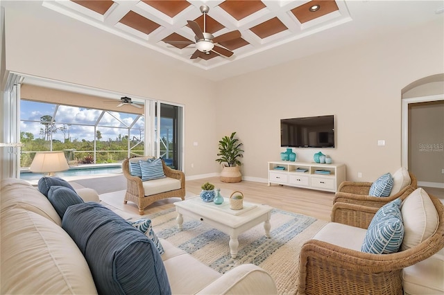 116 Hercules Dr, Rotonda West, FL 33947 - living area with a ceiling fan, a sunroom, coffered ceiling, a towering ceiling, and baseboards