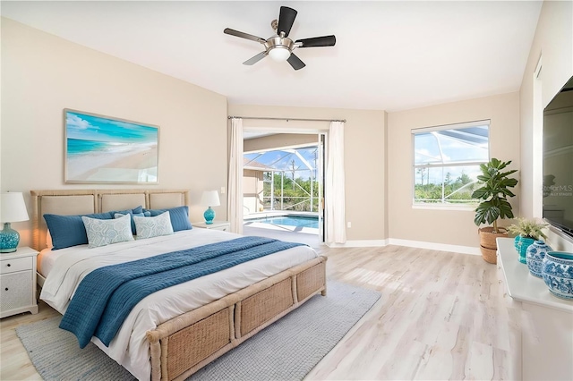 116 Hercules Dr, Rotonda West, FL 33947 - bedroom featuring light wood finished floors, access to exterior, baseboards, and ceiling fan
