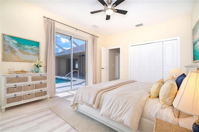 116 Hercules Dr, Rotonda West, FL 33947 - bedroom featuring access to exterior, light wood-style flooring, a closet, and a ceiling fan