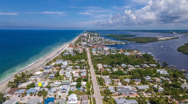 aerial view featuring a view of the beach and a water view