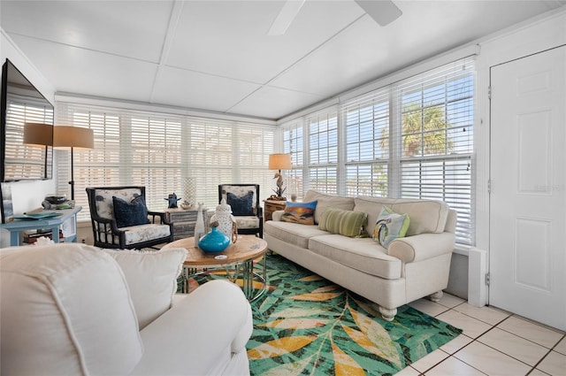 living area featuring light tile patterned flooring and a ceiling fan