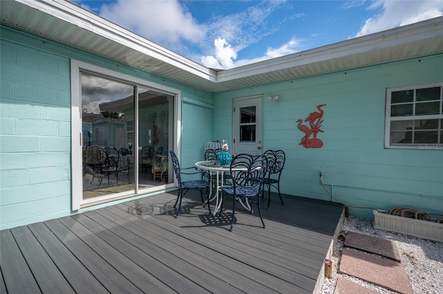 wooden terrace with outdoor dining area