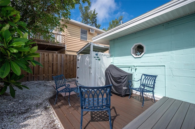 wooden terrace featuring fence and grilling area