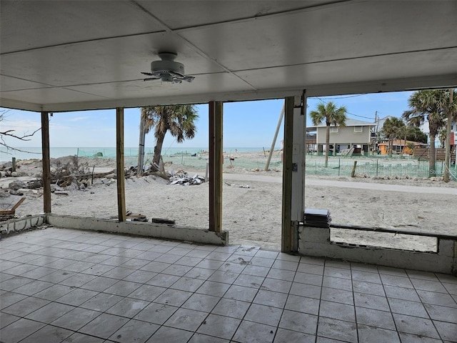 view of patio / terrace with ceiling fan and fence