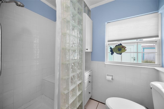 full bath with crown molding, tile walls, toilet, a walk in shower, and tile patterned floors