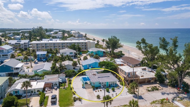 aerial view with a water view and a view of the beach