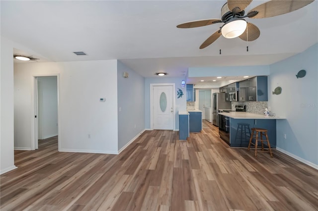 unfurnished living room featuring dark hardwood / wood-style floors and ceiling fan