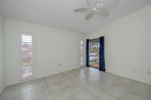 spare room with lofted ceiling and ceiling fan