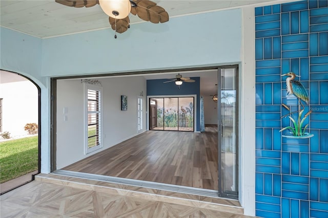 entrance to property featuring ceiling fan