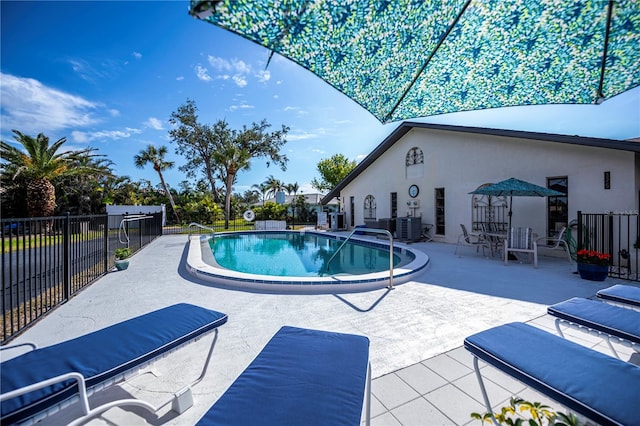 view of swimming pool featuring central AC and a patio area