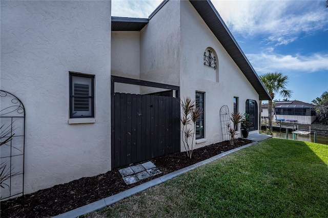 view of home's exterior featuring a lawn