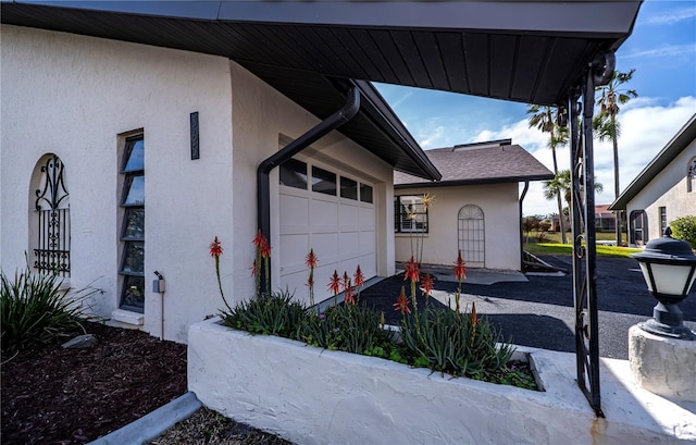 view of side of home featuring a garage