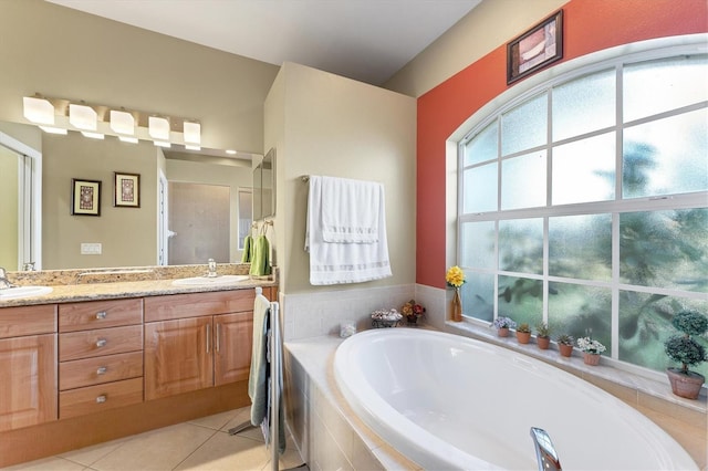 bathroom with vanity, tile patterned floors, and plus walk in shower