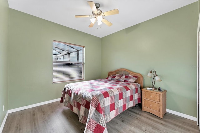 bedroom featuring ceiling fan and hardwood / wood-style floors