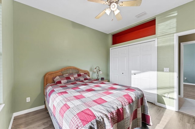 bedroom featuring a closet, ceiling fan, and hardwood / wood-style flooring