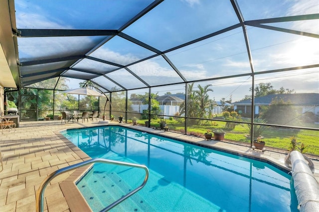 view of pool with a lanai and a patio