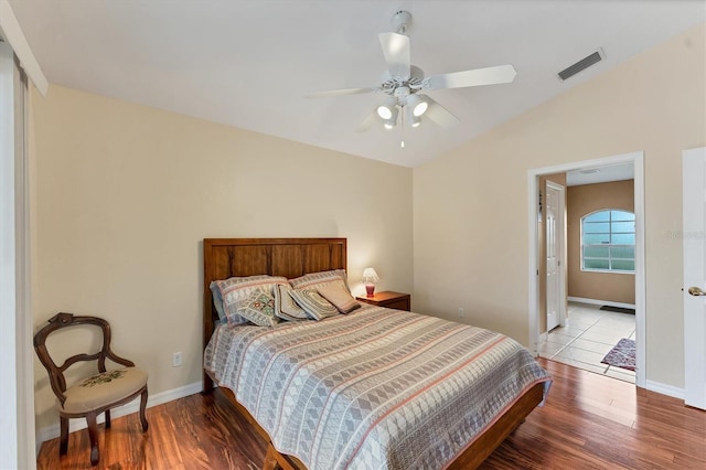 bedroom featuring lofted ceiling, ceiling fan, and light hardwood / wood-style floors